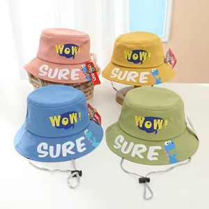 Detail view of kids cotton bucket hats with WOW letters and adjustable windproof straps