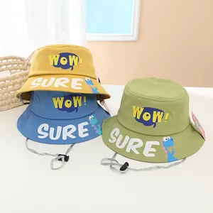 Detail of kids bucket hats with WOW print and adjustable chin strap in three colors