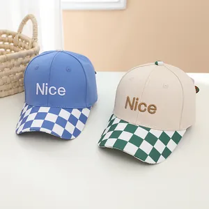 Kids baseball caps with Nice embroidery and checkerboard brim in blue and beige cotton