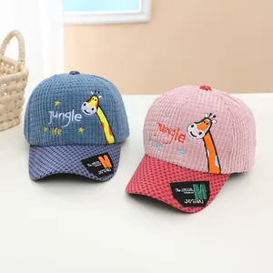Detail of corduroy texture and giraffe embroidery on kids baseball caps in pink and blue