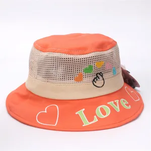 Detail of orange kids sun hat featuring breathable mesh, heart embroidery, and Love print