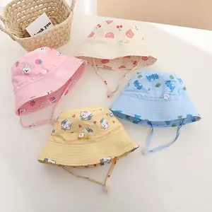 Detail of baby sun hats with adjustable windproof chin straps and cartoon prints