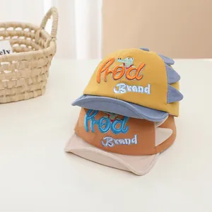 Close-up of dinosaur baseball caps showing detailed 3D fins and embroidery