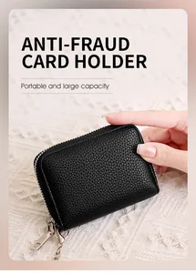 Detail of black litchi grain leather RFID card holder with silver chain and zipper