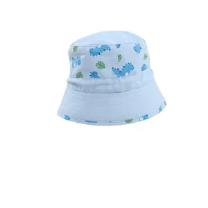 Kids blue reversible sun bucket hat with cute dinosaur and palm leaf patterns