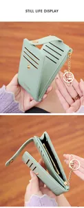 Detail view of mint green PU leather card holder with multiple slots and zip pocket