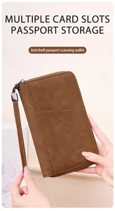 Brown leather RFID passport wallet with multiple card slots and detachable wrist strap