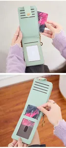 Detail of mint green folding wallet interior with card slots and zipper pocket