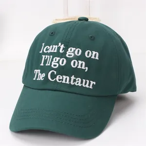 Detail of high-density white embroidery on a dark green cotton baseball cap for kids