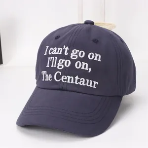Detailed view of white embroidery and reinforced stitching on a navy cotton baseball cap