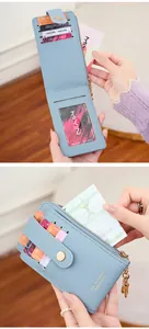 Macro detail of blue PU leather wallet showing multiple card slots and golden zipper