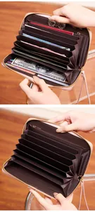 Pink PU leather long wallet detail showing multiple accordion compartments and coin pocket
