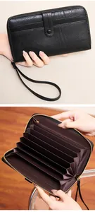 Detail view of black vintage organ wallet with large capacity card slots and wrist strap