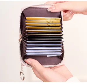 Internal detail of pink RFID leather card holder showing multi-slot accordion style slots