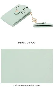 Detail of mint green lychee grain PU leather card holder with gold snap and key chain