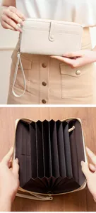 Detailed interior of the long accordion wallet showing card slots and zipper pocket