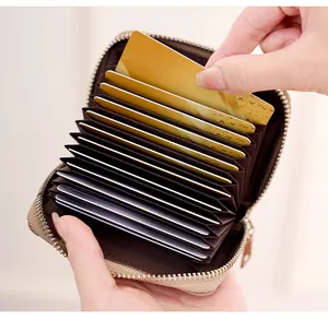 Detail of RFID leather card holder with multiple accordion slots and secure zipper closure