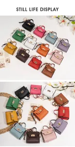 Mini handbag charms in various colors featuring lychee grain leather and gold hardware