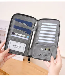 Internal view of a grey RFID blocking travel wallet showing passport and card slots