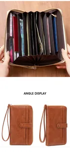 Macro detail of brown leather long wallet featuring multi-slot accordion style interior