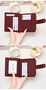 Detail view of wine red RFID leather wallet with multi-card slots and secure zip pocket