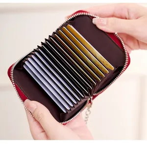Detailed interior of red RFID blocking leather card holder with multi-slot accordion design