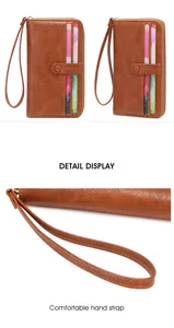 Brown vintage long wallet featuring multiple card slots and comfortable hand strap detail