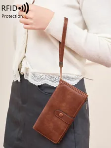 Portefeuille RFID vintage en cuir marron pour femme avec dragonne et zip de sécurité