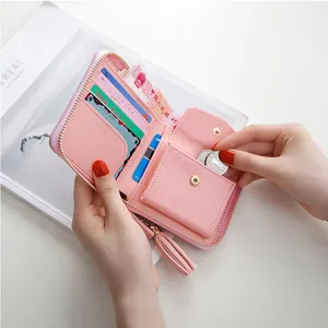 Pink minimalist leather square wallet with tassel zipper and interior coin pocket