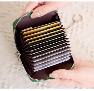Close-up of green RFID blocking accordion card holder with metal keychain ring