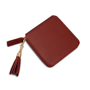 Burgundy short square zip-around wallet with litchi texture and leather tassel charm