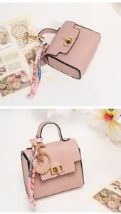 Pink lychee grain mini bag keychain with printed silk scarf handle and gold hardware
