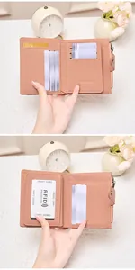 Detail of pink RFID blocking wallet featuring multiple card slots and a clear ID window
