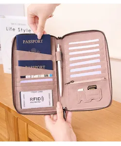 Close-up of pink RFID passport wallet interior with multi-functional storage compartments