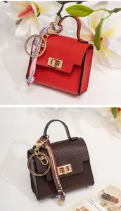 Mini leather handbag charm in red and brown with silk scarf and gold keychain
