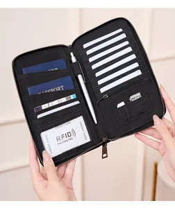 Detail of RFID blocking passport wallet with multi-card slots and secure zipper pocket
