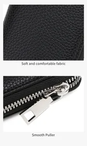 Detail of soft textured black fabric and smooth silver metal zipper puller component