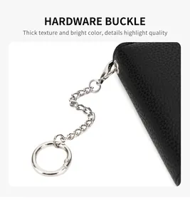 Detail of durable silver hardware buckle and premium lychee grain leather keychain
