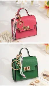 Mini handbag keychain charm with litchi texture and silk scarf in emerald and rose red
