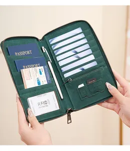 Detail view of the green RFID passport wallet interior with multiple storage compartments