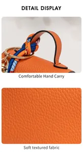 Detailed view of orange pebbled leather bag with decorative silk scarf and metal ring