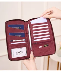 Interior view of burgundy RFID blocking travel wallet with card slots and passport holders