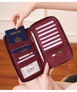 Detail of burgundy RFID passport wallet interior with multi-card slots and coin pocket