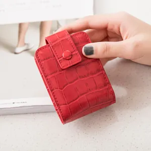 Red crocodile texture mini makeup bag with mirror and snap closure for lipstick