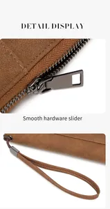 Close-up of RFID passport wallet with smooth dark metal hardware and wrist strap