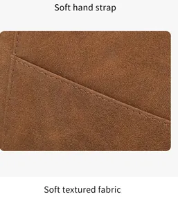 Detail showing soft hand strap and textured fabric of the brown RFID passport wallet