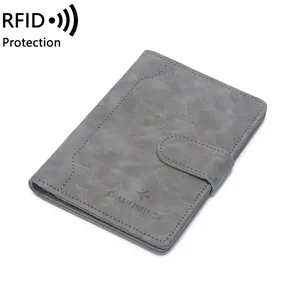Cold grey RFID passport holder with buckle closure and travel embossed logo
