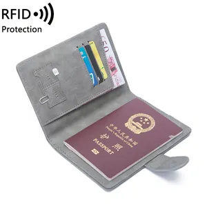 Gray RFID blocking passport wallet with multi-functional card slots and snap closure