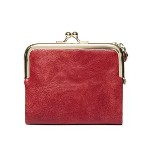Vintage red leather mini wallet with gold kiss-lock closure and metal keychain