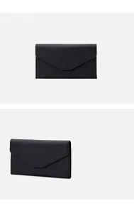 Detail of black Saffiano texture RFID travel passport wallet with minimalist envelope design